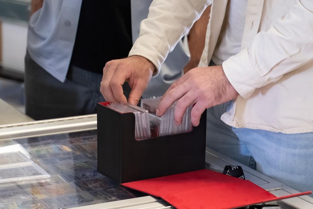 Staff checking cards from a box at the counter